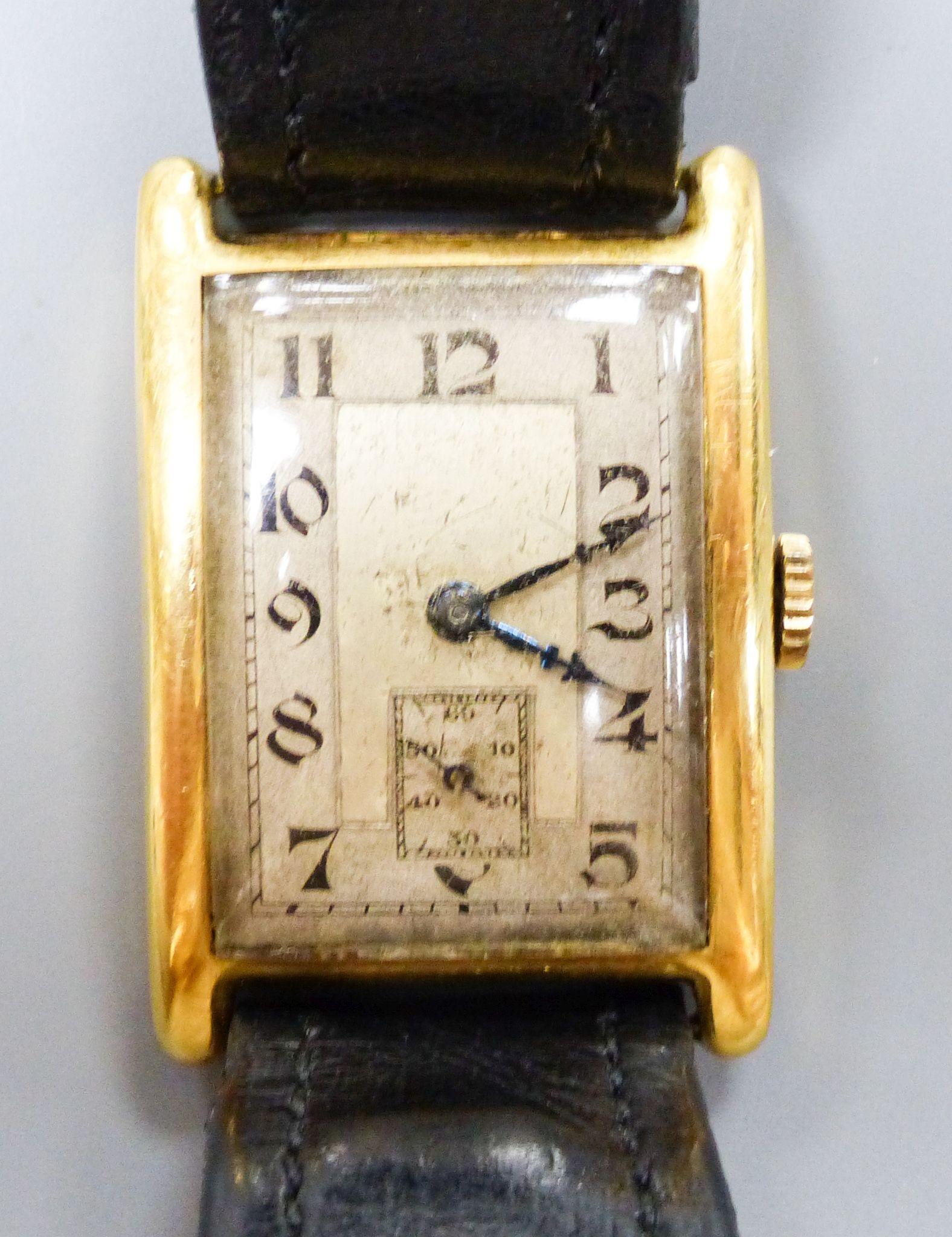 A gentleman's 1930's 18ct gold Aster manual wind rectangular dial wrist watch, on a leather strap, cased diameter 24mm, gross weight 27.7 grams.